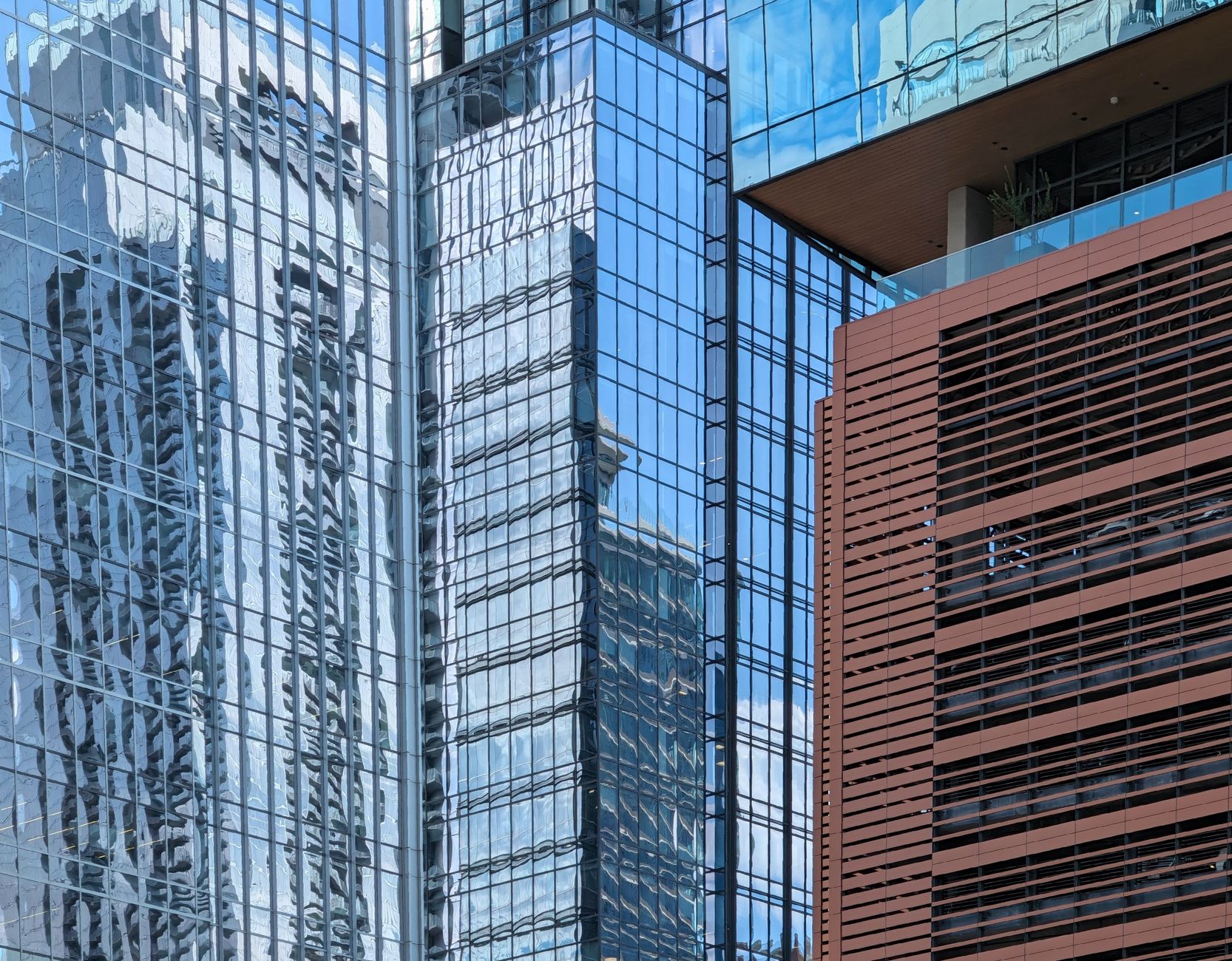 A close-up view of reflective glass skyscrapers in Austin, TX showcasing modern architecture